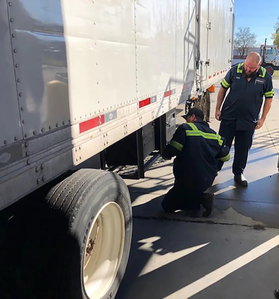 Technician servicing a trailer